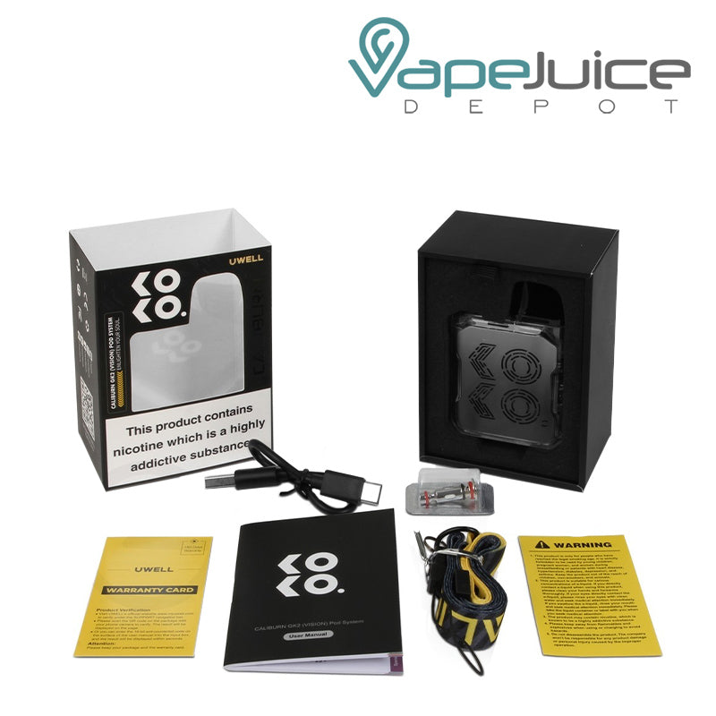 The box of UWELL Caliburn GK2 Vision Pod Kit with a warning sign and package parts in front of it - Vape Juice Depot