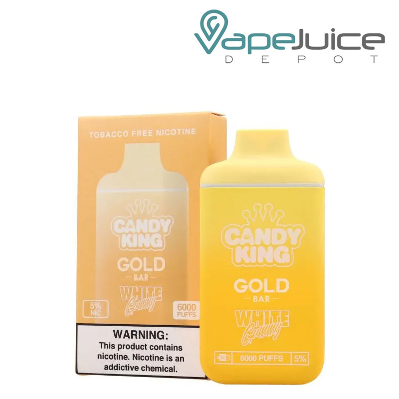 A box of White Gummy Candy King Gold Bar 6000 Disposable  with a warning sign and a disposable next to it - Vape Juice Depot