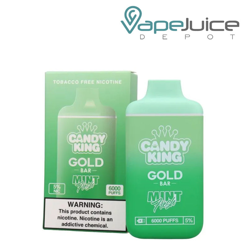 A box of Mint Fresh Candy King Gold Bar Disposable  with a warning sign and a disposable next to it - Vape Juice Depot