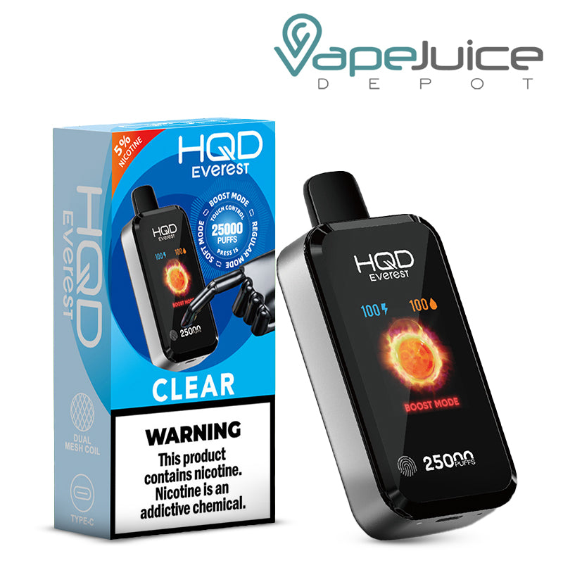 A Box of HQD Everest 25000 Clear Disposable Vape with a warning sign next to the disposable vape with its smart screen being visible - Vape Juice Depot